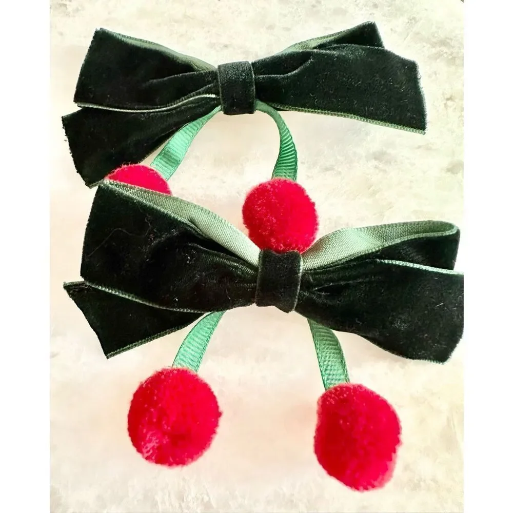 Dark green velvet hair bow with cherry red pom poms